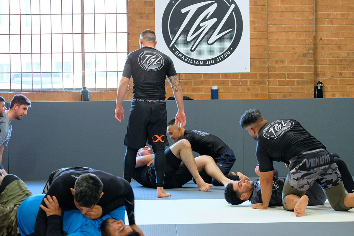 the grappling lab brazilian jiu jitsu prestons instructor watching students sparring